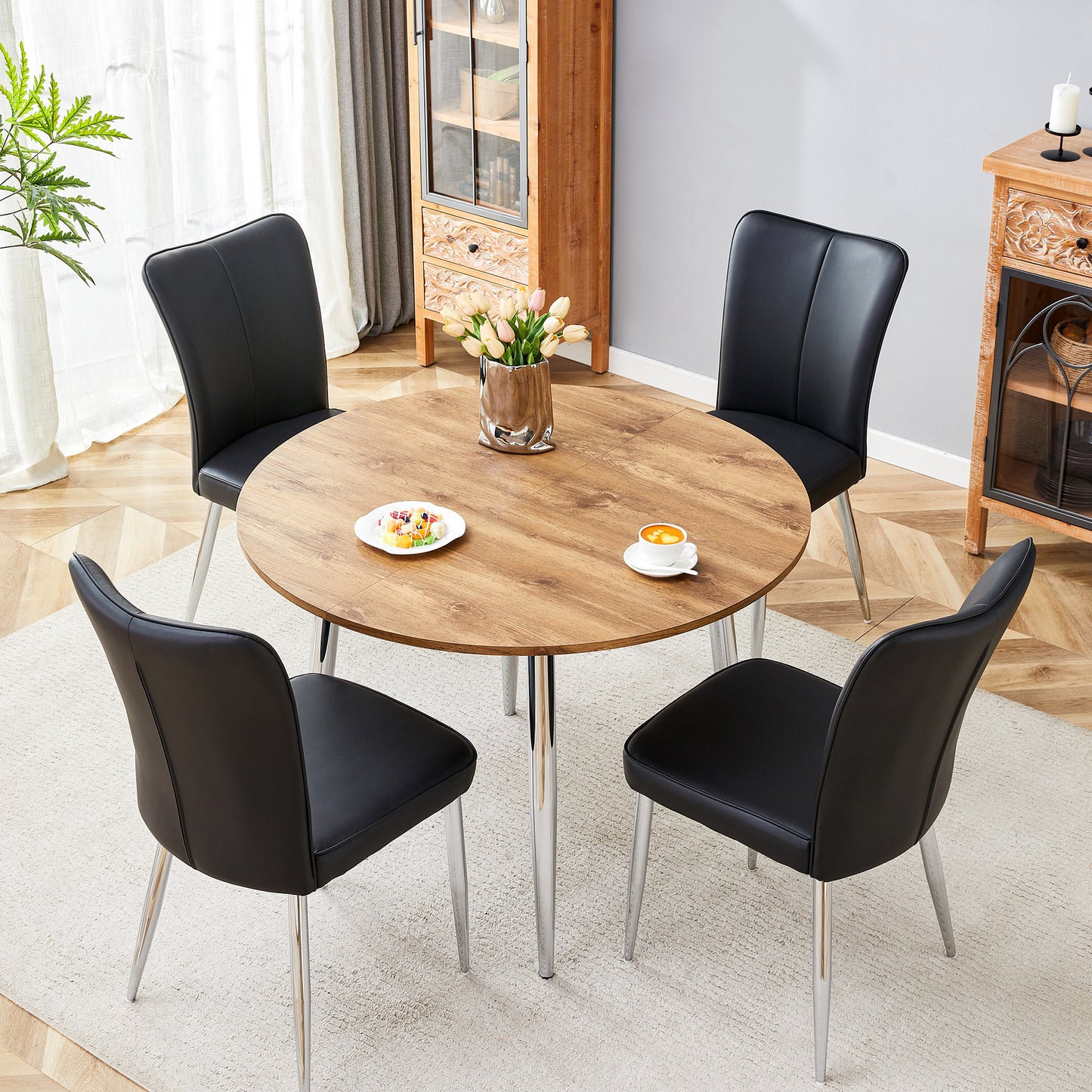 Table And Chair Set.With A Expandable Mechanism,the Wood Grain MDF Table Top And Silver Metal Legs And Has A Smooth Surface.Paried With 4 Black PU Chairs With A Vertical Stripe Design On The Backrest.