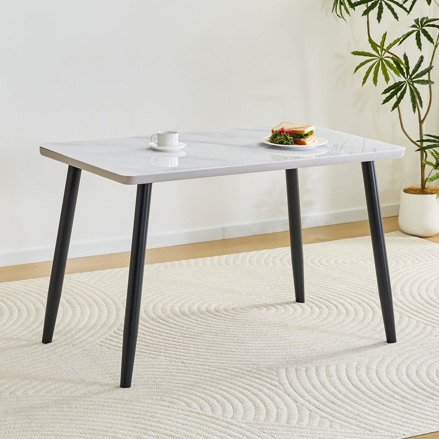Modern Minimalist Rectangular Dining Table,suitable For 4-6 People.Tempered Glass Countertop Lower MDF Board,imitation Marble Texture,black Metal Tapered Legs.Suitable For Minimalist Restaurants.