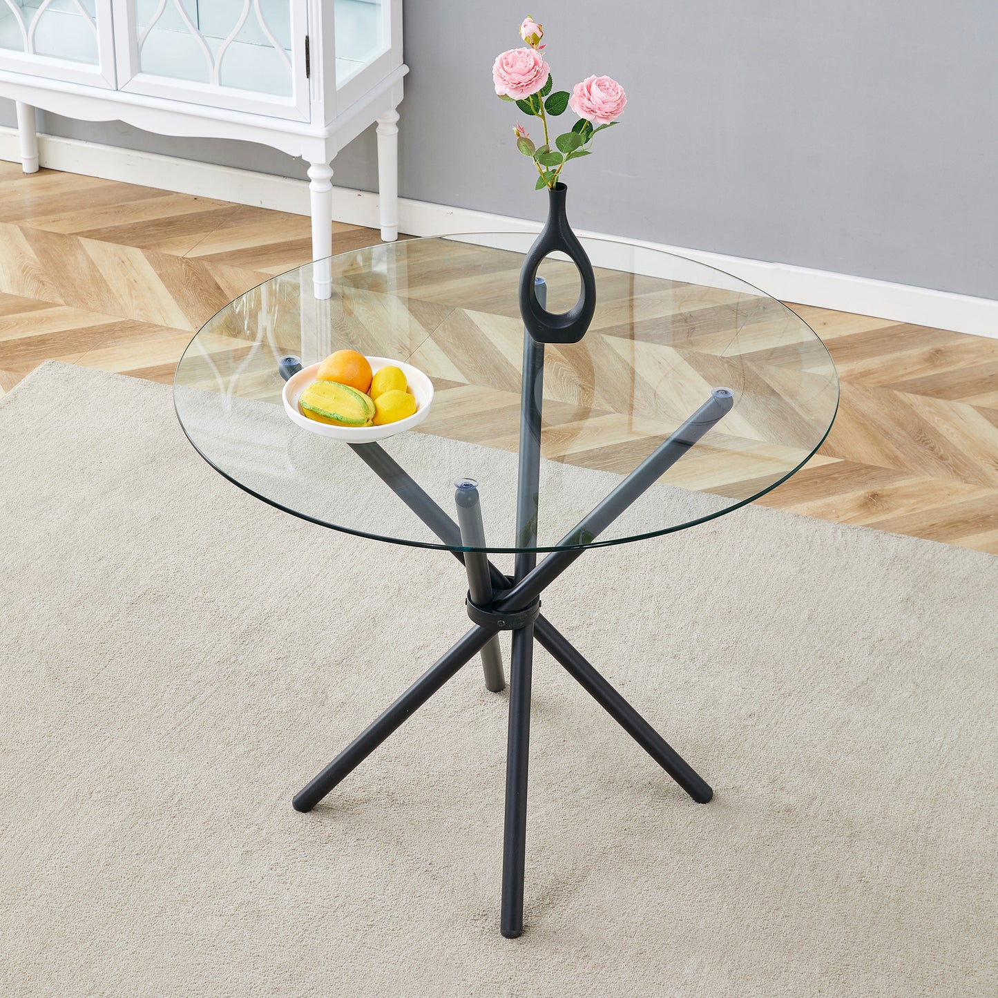 A Circular Transparent Tempered Glass Round Table With A Diameter Of 36.6 Inches,with Ring-shaped Gathered Black Metal Legs.The Desktop Glass Is 0.3 Inches Thick.W1151P294396
